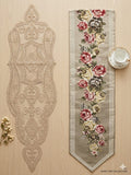 Decorative table runner with floral pattern on a wooden surface