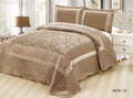 Brown textured comforter set on a bed with matching pillows in a bedroom setting.