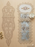 Decorative lace table mats on a wooden surface with 'Premium Linens' branding.